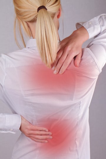 Woman with neck / back pain.
